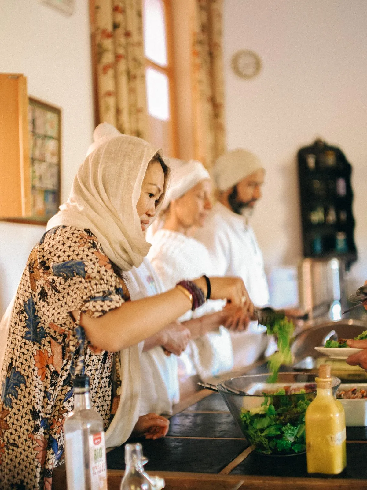 The team preparing a meal in the Ashram kitchen