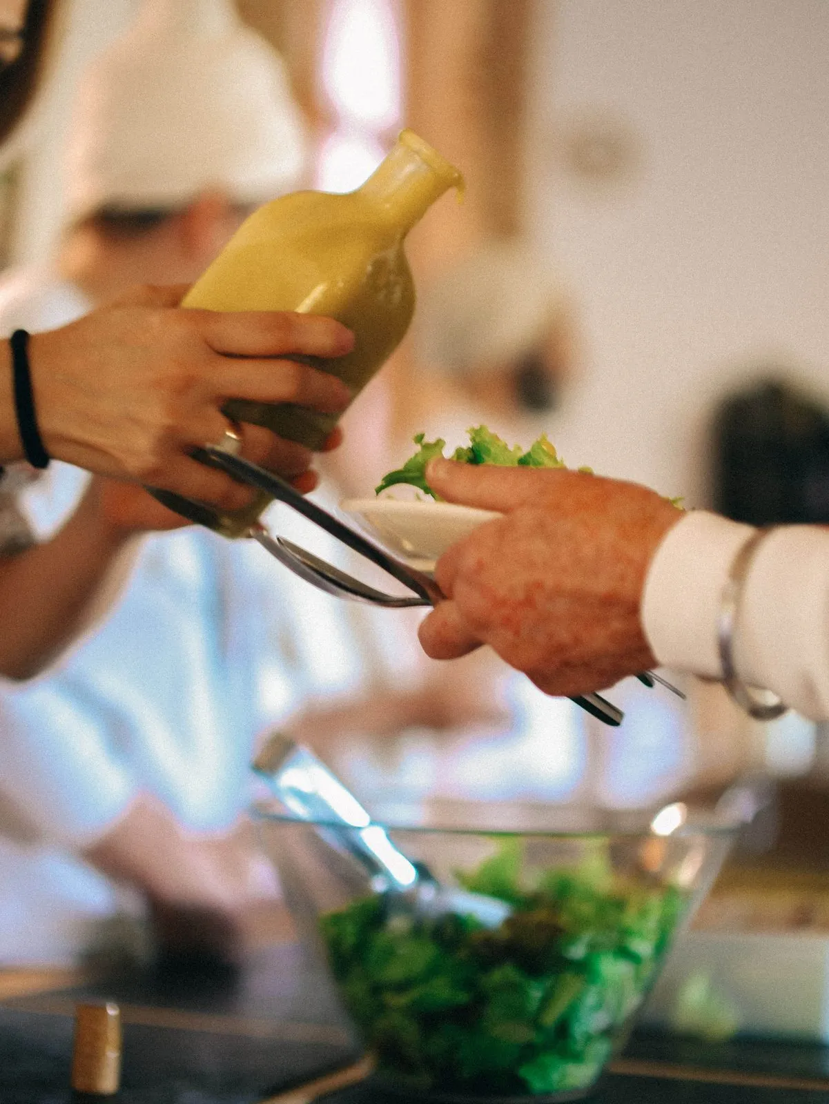 Salad being served at a meal